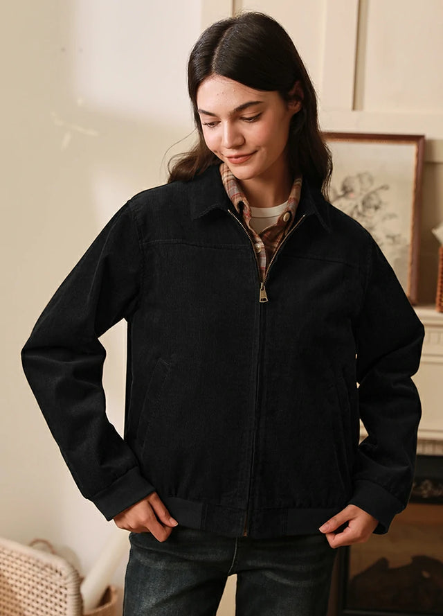 Women wearing a black long sleeves corduroy jacket with full zip