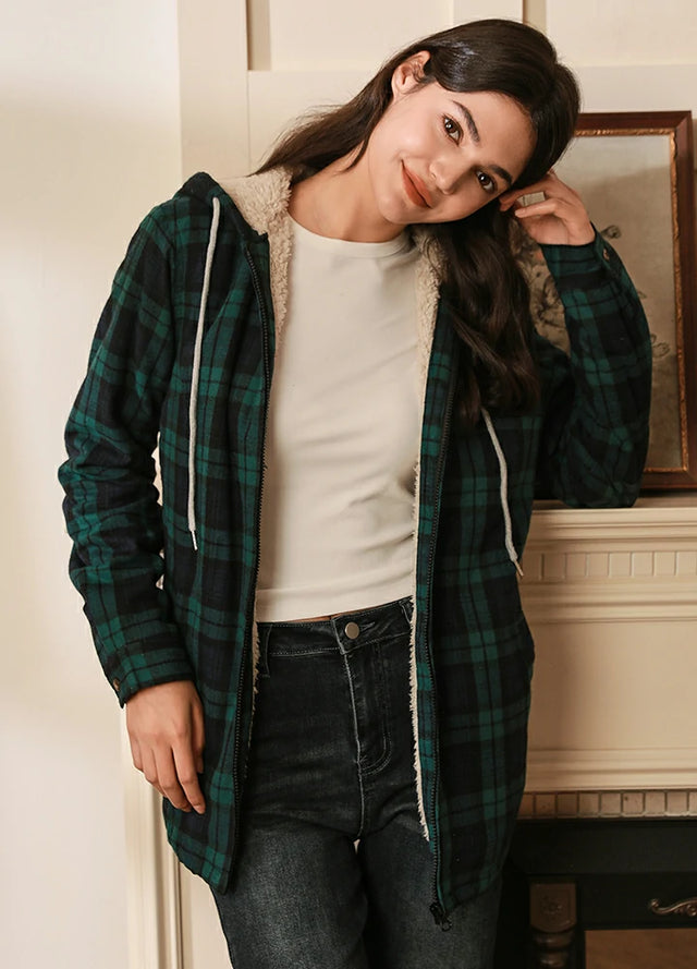 Women wearing a green black zip up sherpa lined plaid flannel hooded
