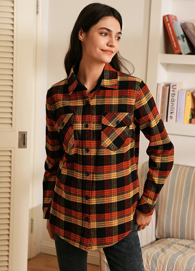 Women wearing a button down red black plaid flannel shirt