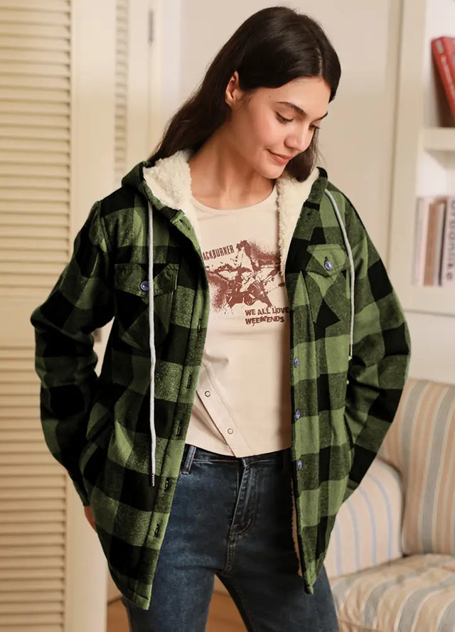 Women wearing a black and green plaid hoodie with sherpa lined