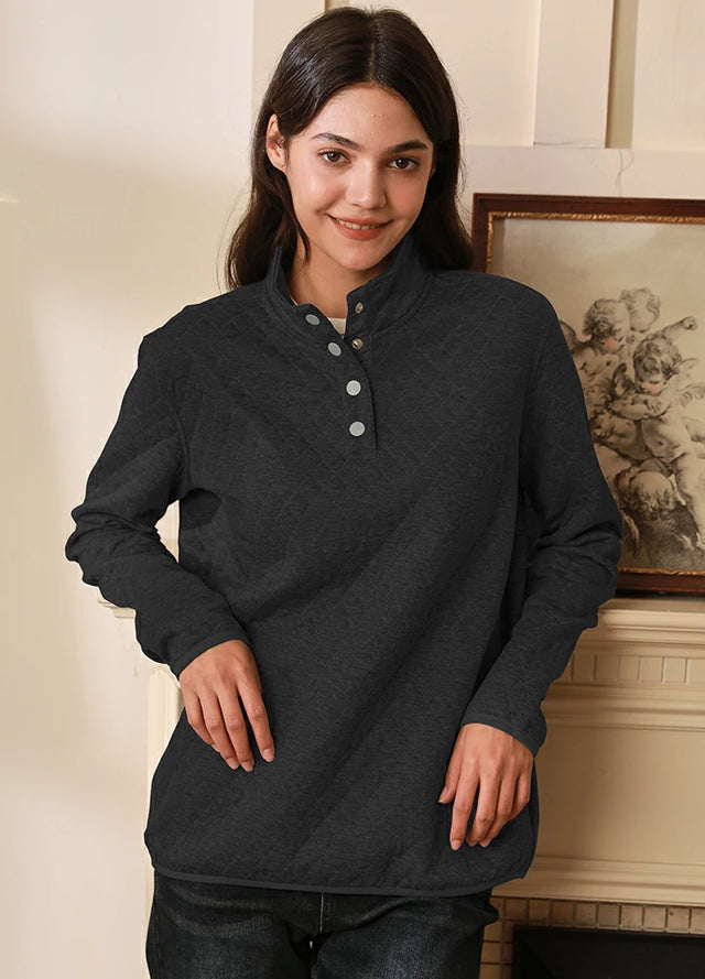 Women wearing a long sleeves solid black quilted fleece pullover