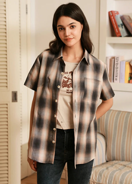 Women wearing a pink grey button up cotton plaid shirt