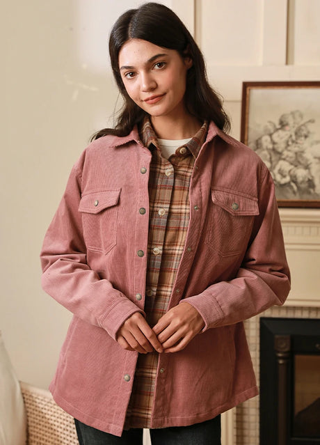 Women wearing a pink corduroy shirt jacket
