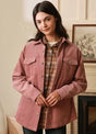 Women wearing a pink corduroy shirt jacket