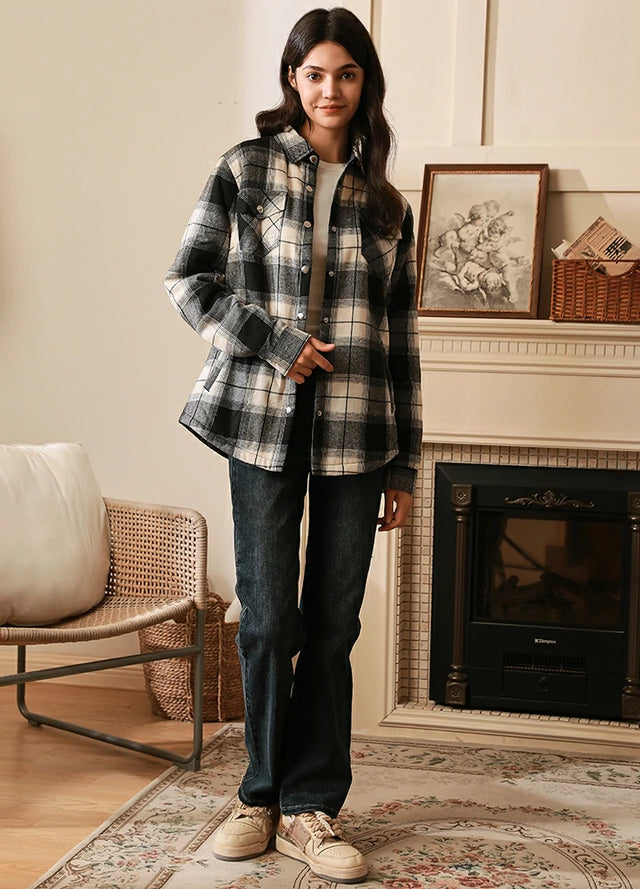 Women wearing a sherpa lined white black flannel shirt jacket