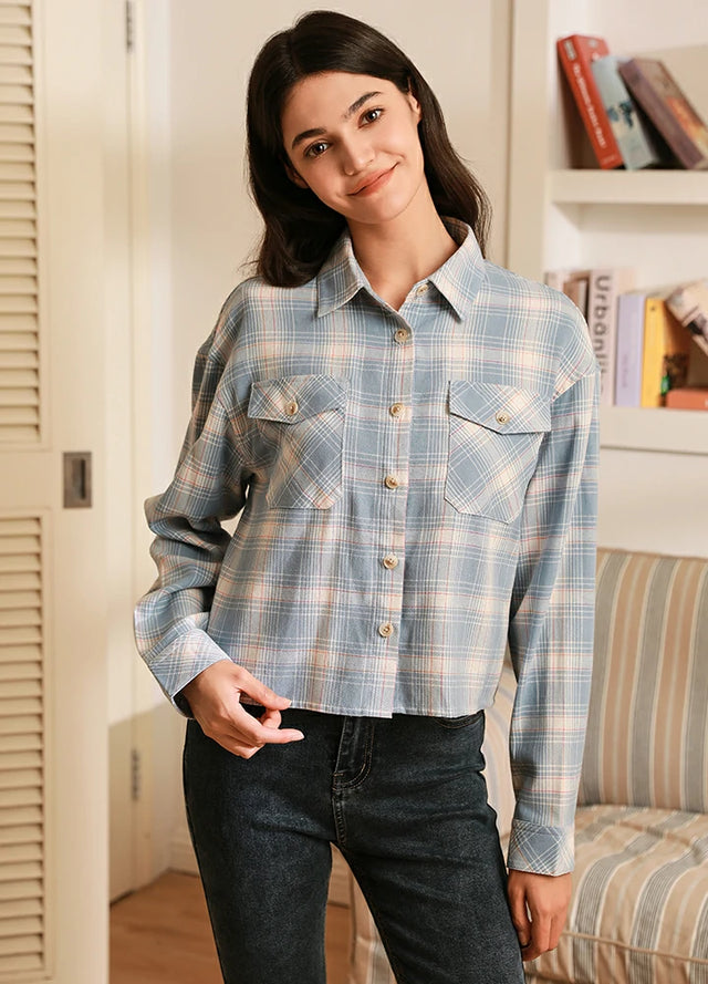 Women in a breathable button down baby blue plaid cropped shirt