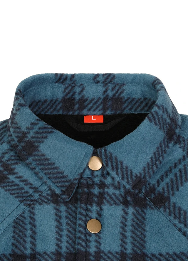Close-up of a blue and black plaid fleece button-up shirt collar with gold buttons, shown against a plain white background.