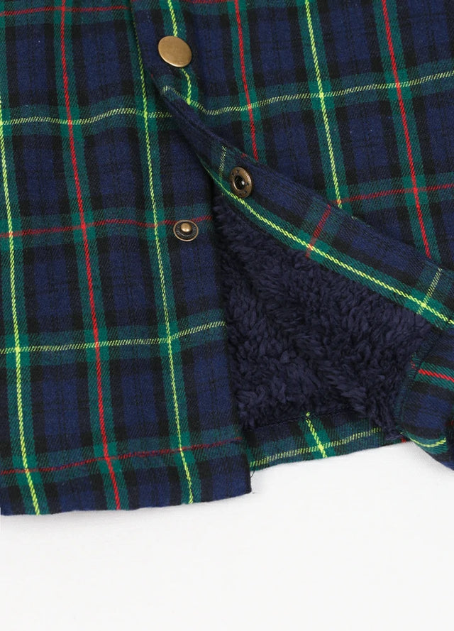 Close-up of the hem of the Navy Green men's snap front plaid shirt jacket