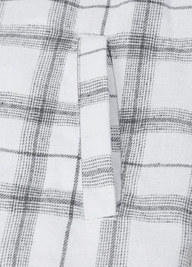 Close-up of the hand pocket of white gray men's snap button flannel plaid hoodie