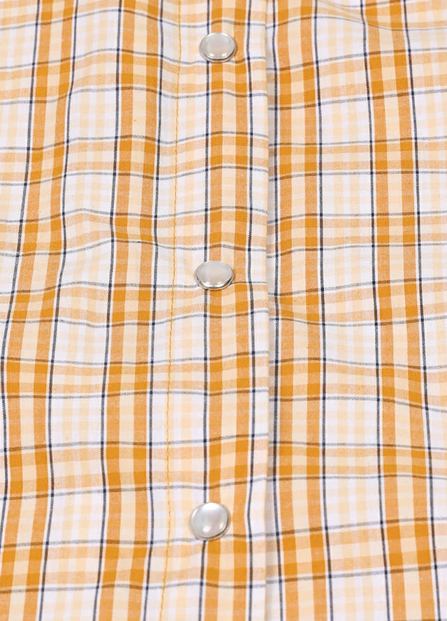 Zoomed-in view of the button on a women's orange white sleeveless plaid vest