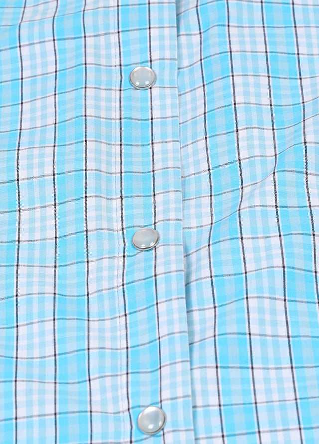 Zoomed-in view of the button on a women's baby blue sleeveless plaid vest