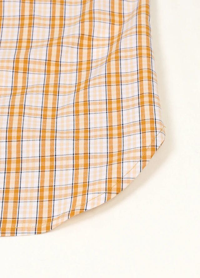 Zoomed-in view of the hem on a women's summer orange white plaid vest