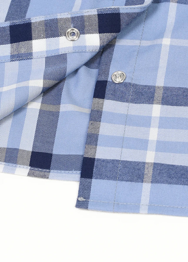 Zoomed-in view of the hem on a womens summer blue plaid vest