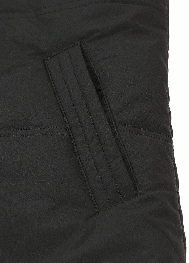 Zoomed-in view of women's black winter warm puffer vest side pocket