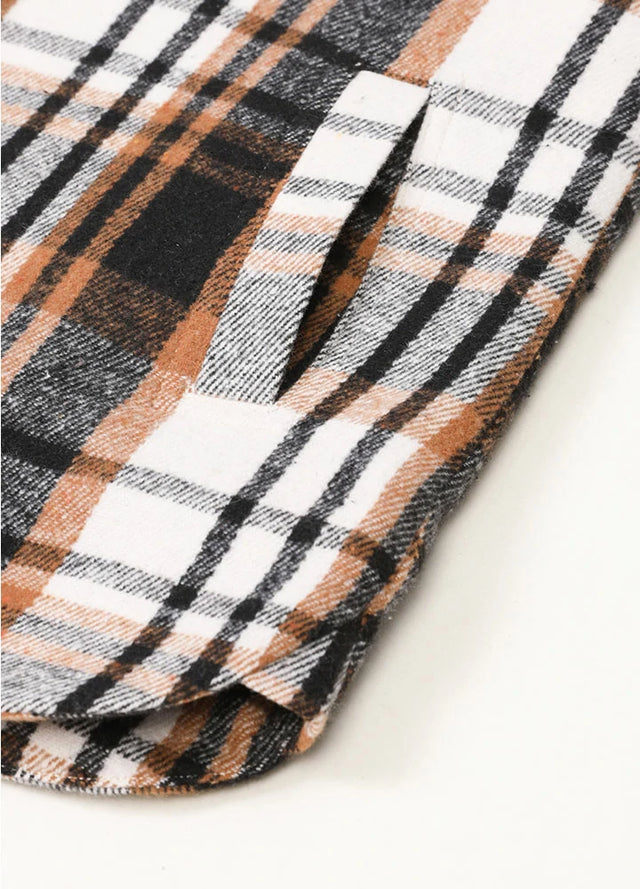 Zoomed-in view of women's black white winter plaid vest hand pocket