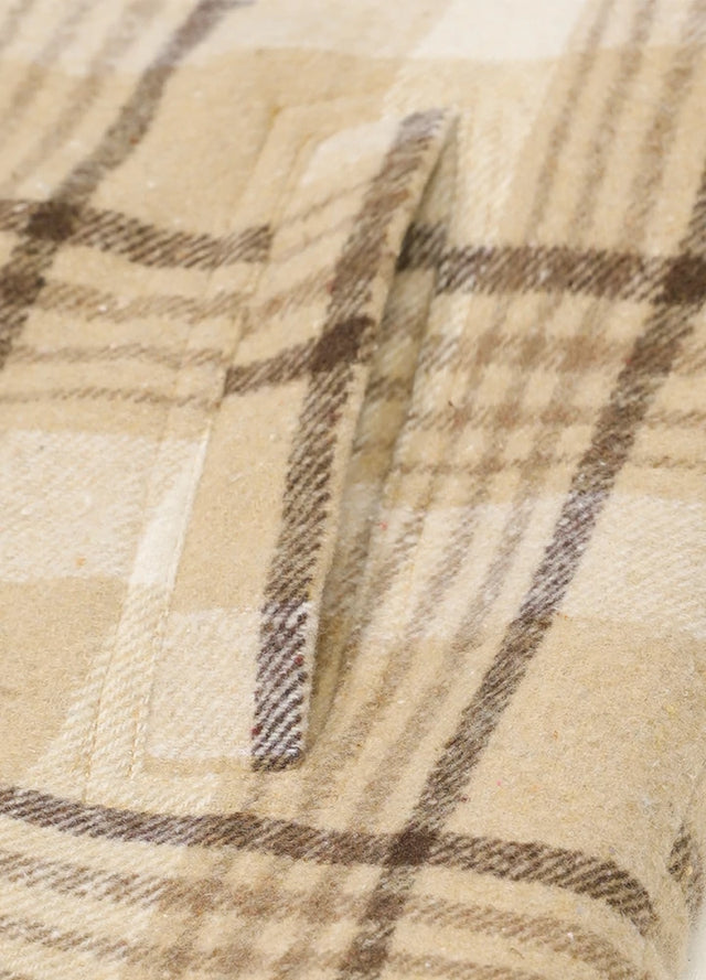 Zoomed-in view of women's light khaki winter plaid vest hand pocket