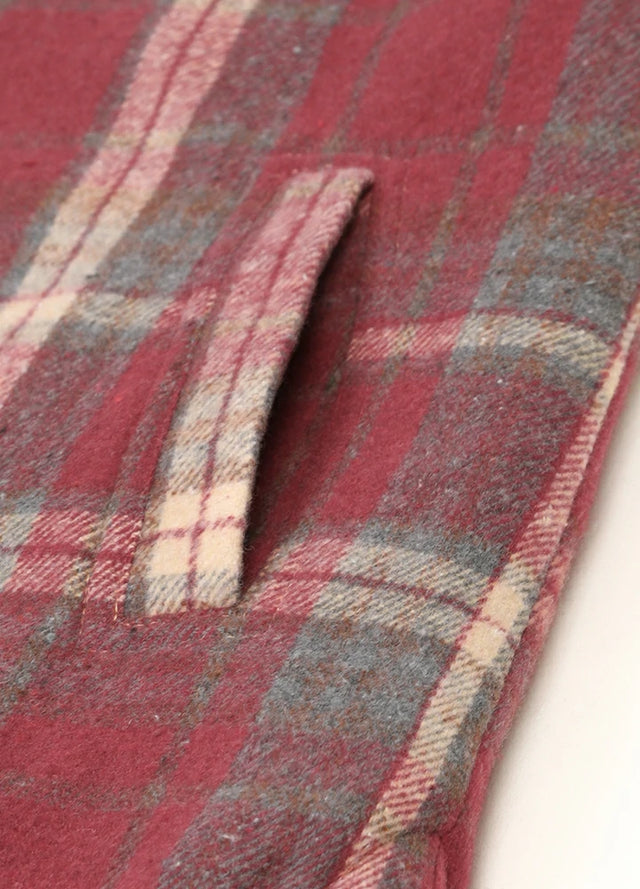 Zoomed-in view of women's purple winter plaid vest hand pocket