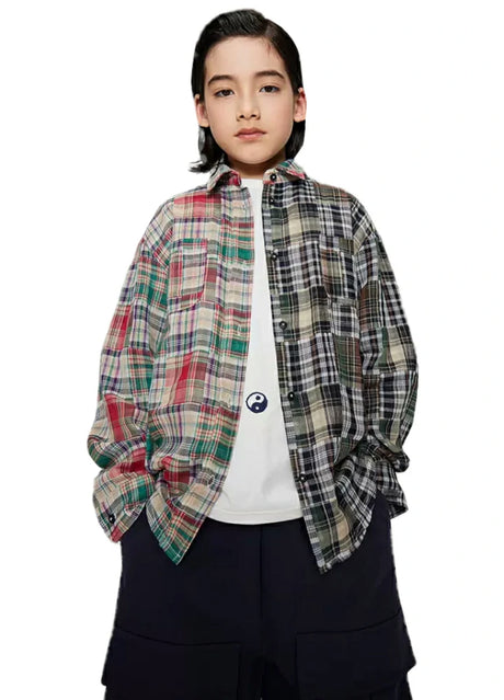 Boy wearing classic multicolor and black-and-white  patchwork flannel plaid shirt