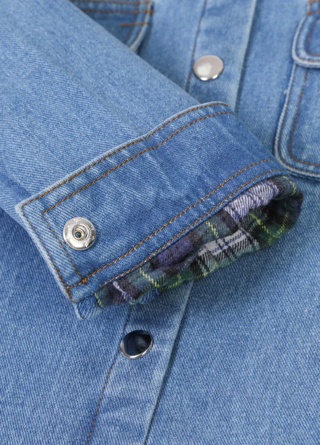 Detail of kids flannel jean shacket with snap button cuffs