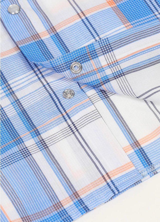 Detail of pearl snap buttons on kid's  blue western sleeveless vest