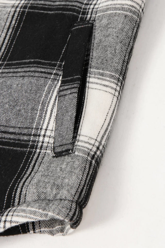 Detail of kids white  black flannel jacket with warm hand pocket