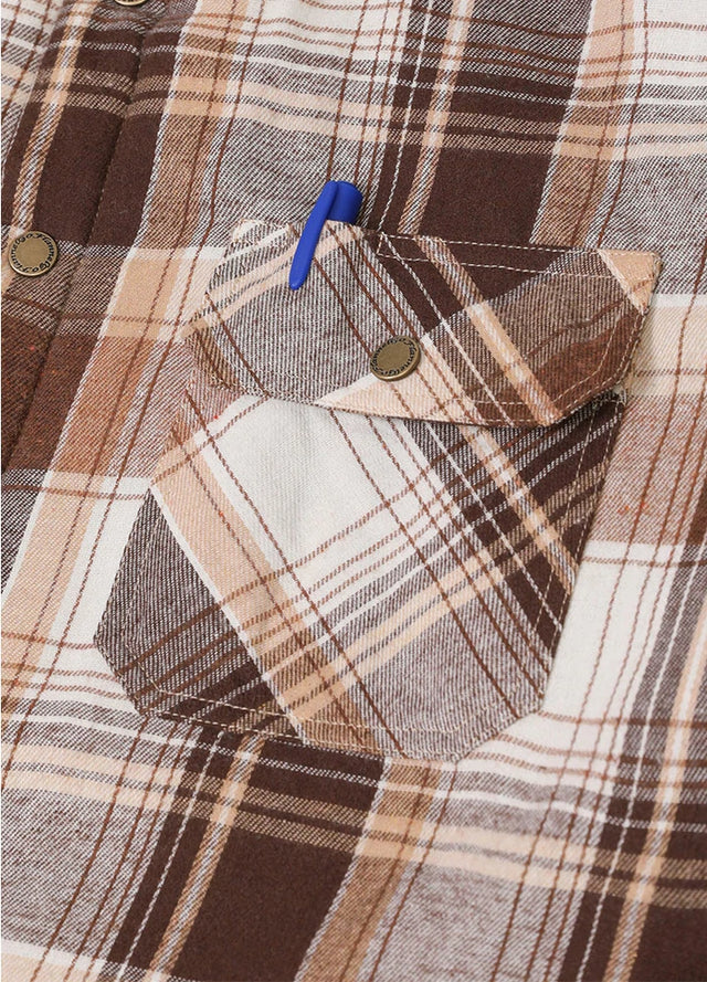 Close-up of the pocket of brown white men's flannel shacket with hood