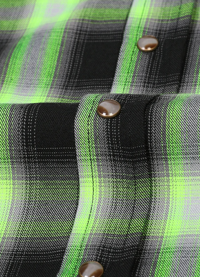 Close-up of the snap button of black green men's western plaid vest