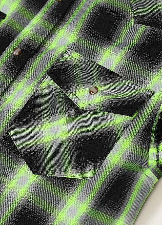 Close-up of the pocket of black green men's durable western outdoor plaid vest