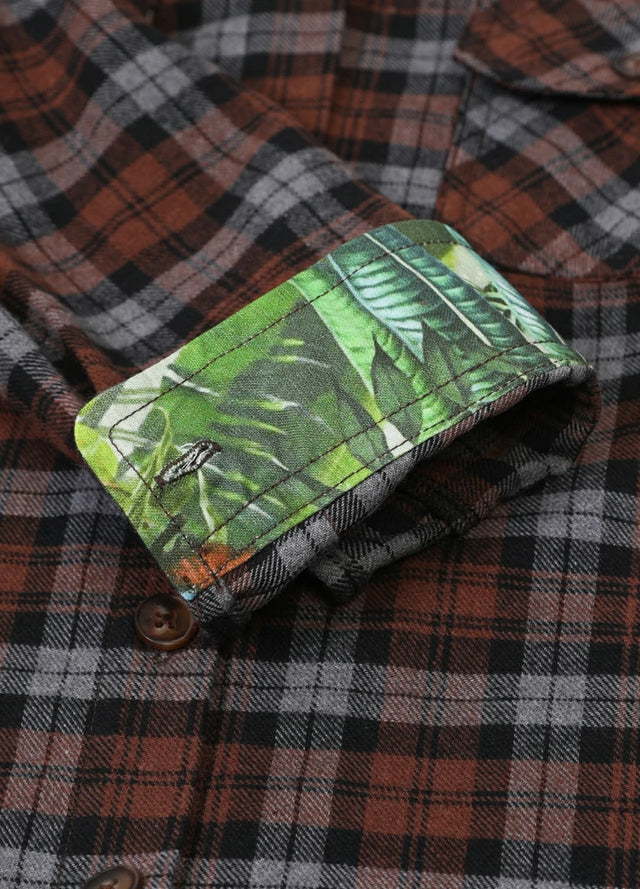Close-up of mens chocolate plaid flannel shirt printed cuffs