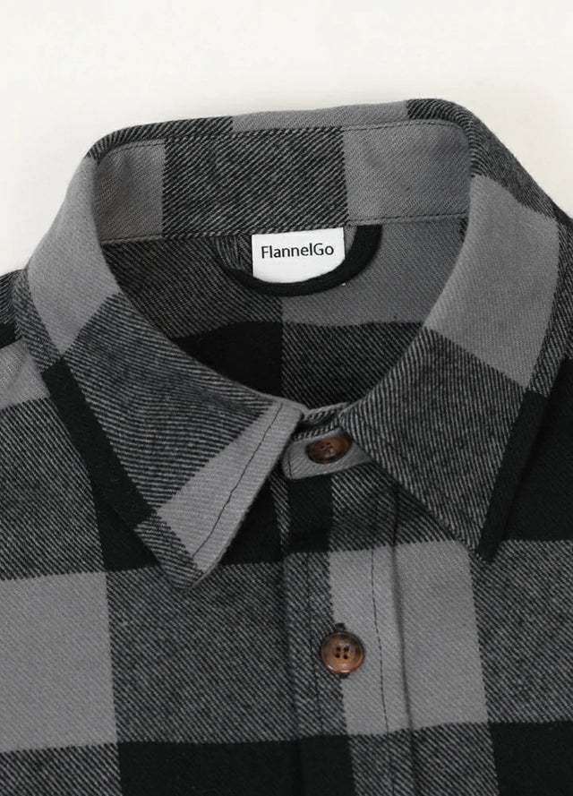 Close-up of the lapel of gray men's stalwart cotton plaid shirt