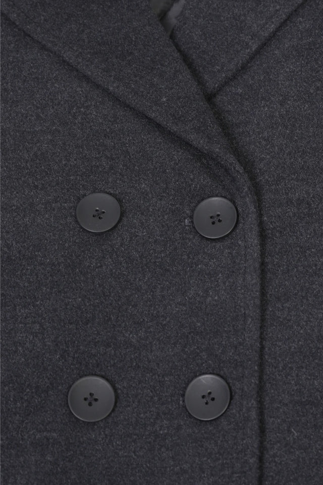 Detailed view of grey boy's wool peacoat double breasted