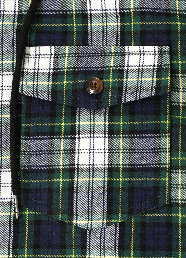 Detail view of the pocket of a green blue men's plaid hooded flannel shirt