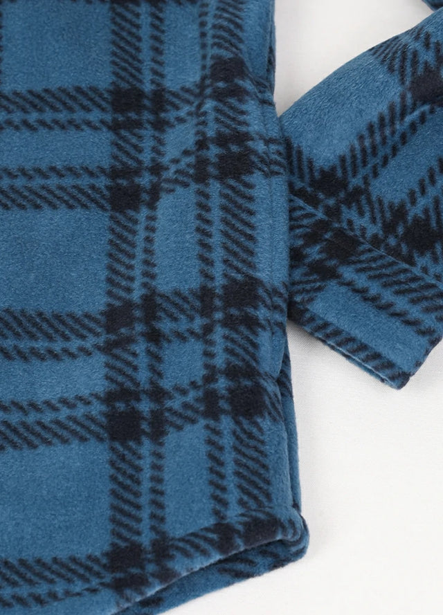 Detailed view of the hand pocket of a blue and gray fleece lined jacket for men