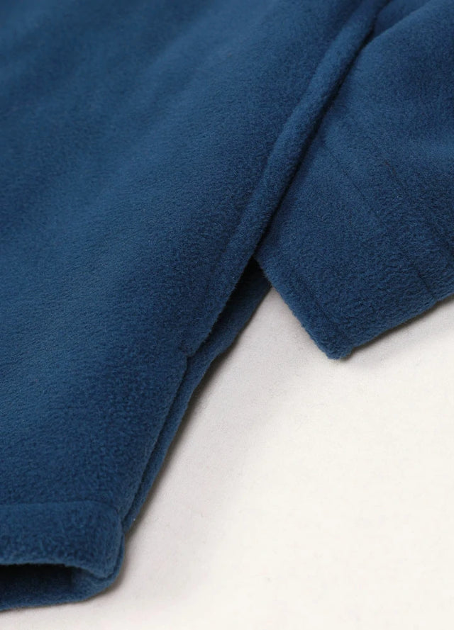Close up of the seam pocket of the dark blue men's outdoor sherpa lined fleece shirt jacket