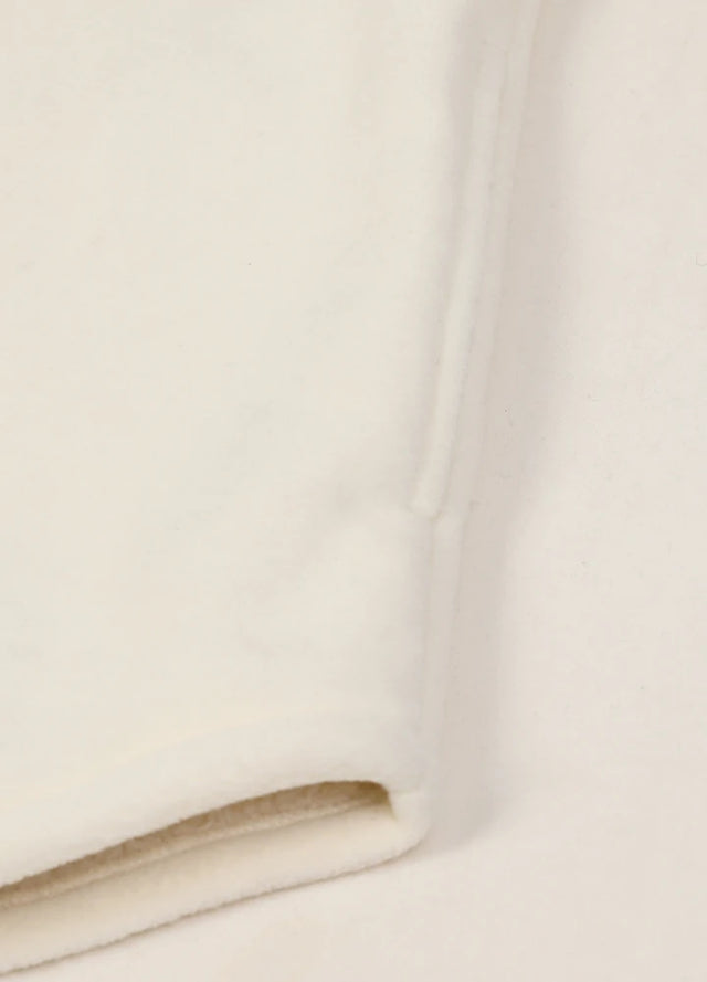 Detailed view of the seam pocket of the solid white men's cozy button up fleece shirt jacket