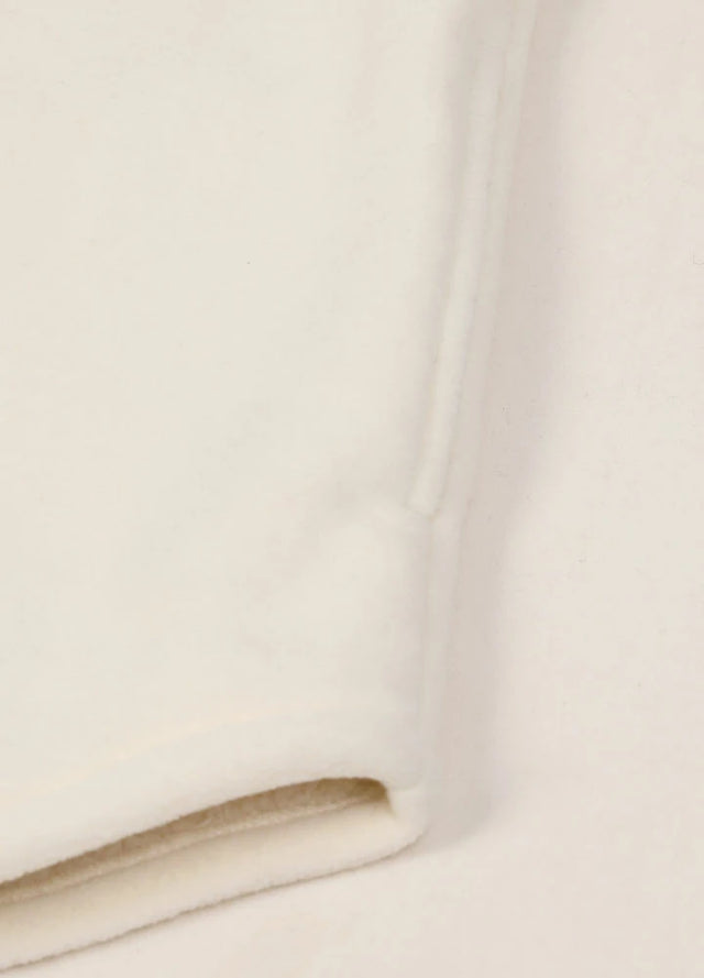 Close up of the seam pocket of men's white cozy fleece lined shacket