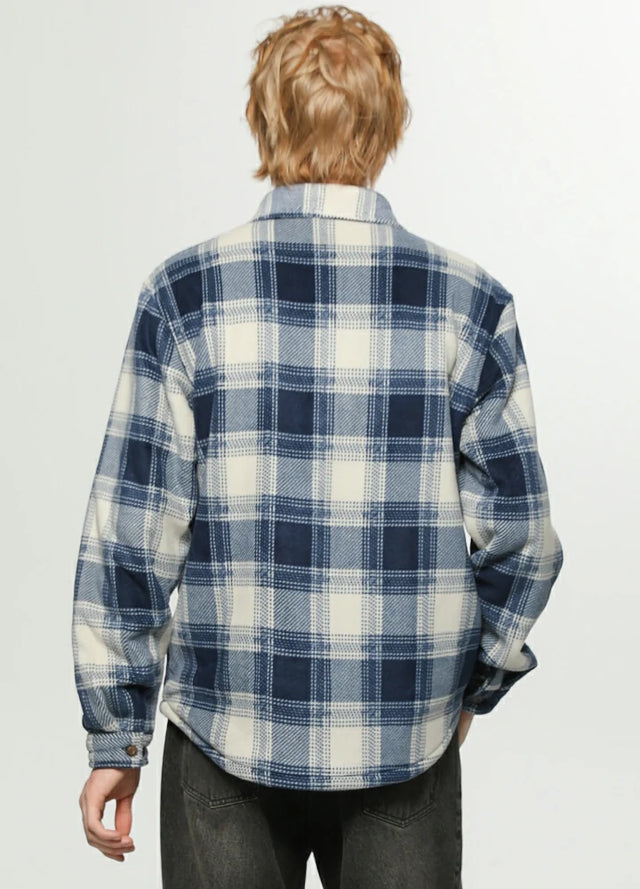 Back view of a man wearing an ocean blue white men's sherpa lined durable plaid jacket