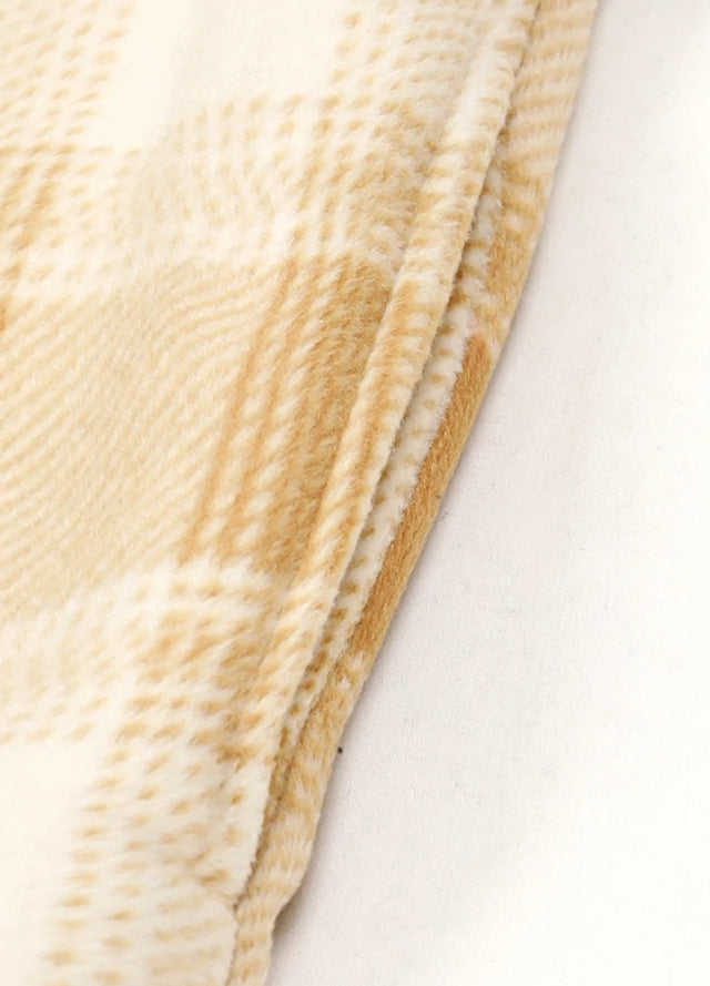 Close-up of the seam pocket of yellow khaki sherpa lined plaid shacket for men