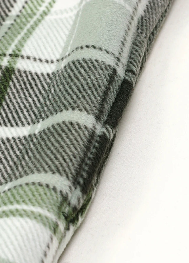 Close-up of the seam pocket of green gray sherpa lined plaid shacket for men