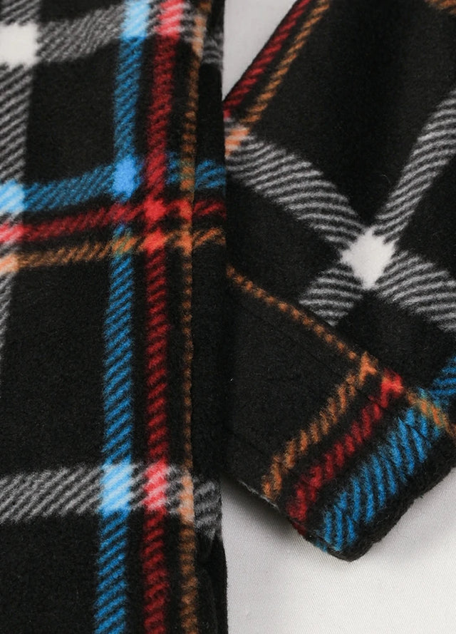 Close-up of the seam pocket of a black and red men's durable plaid shacket