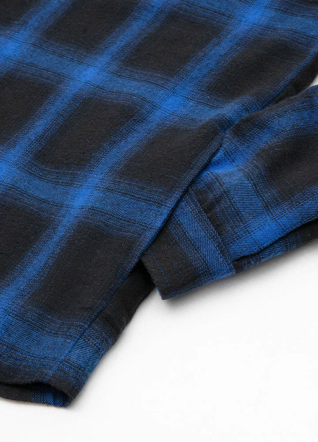Close-up of the seam pocket of a blue and black winter flannel plaid hoodie for men