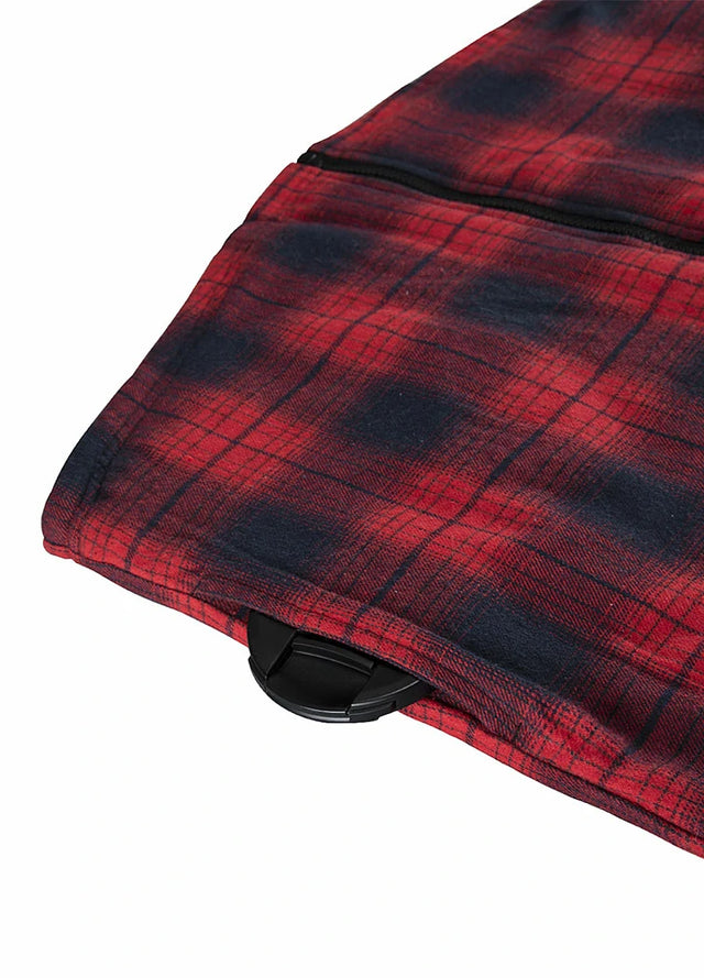 Close-up of the seam pocket of a red and black men's flannel hoodie with sherpa lining