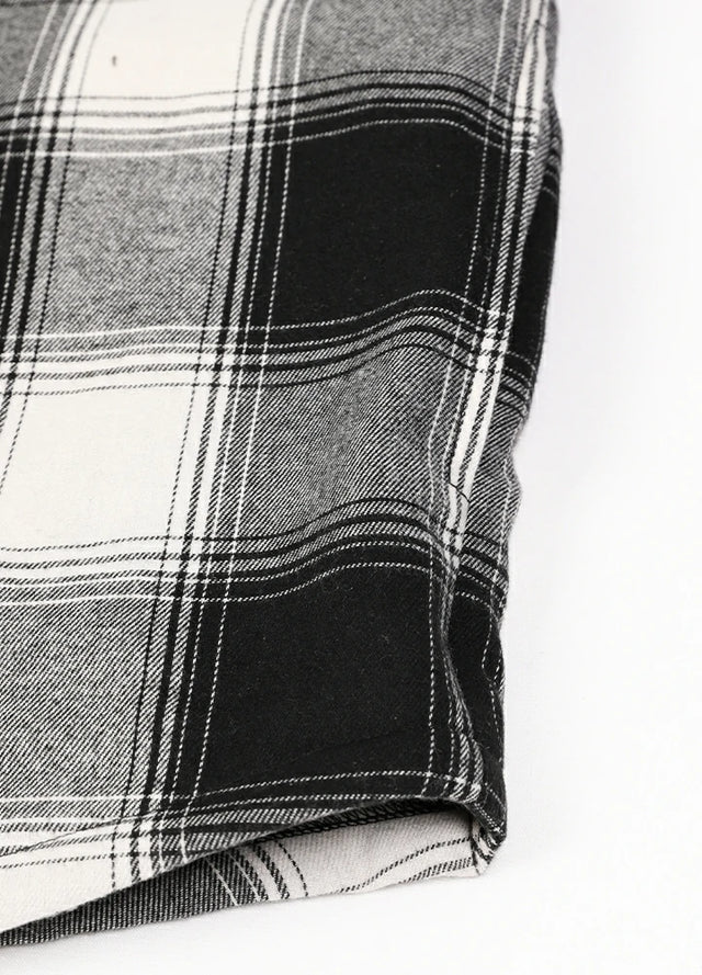 Close-up of the seam pocket of men's white black cozy sherpa lined hooded jacket