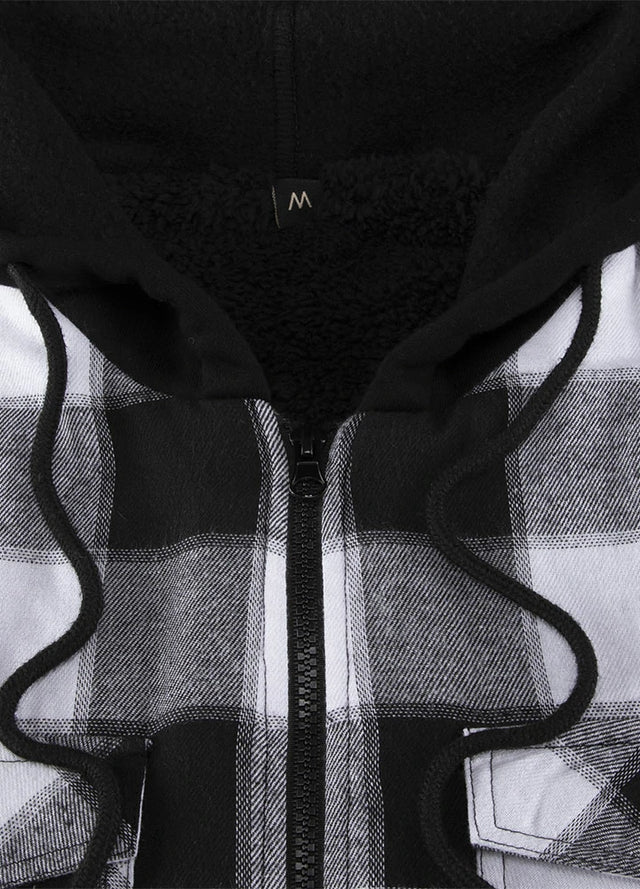 Close-up of the zipper of a black and gray men's winter flannel shacket with a hood