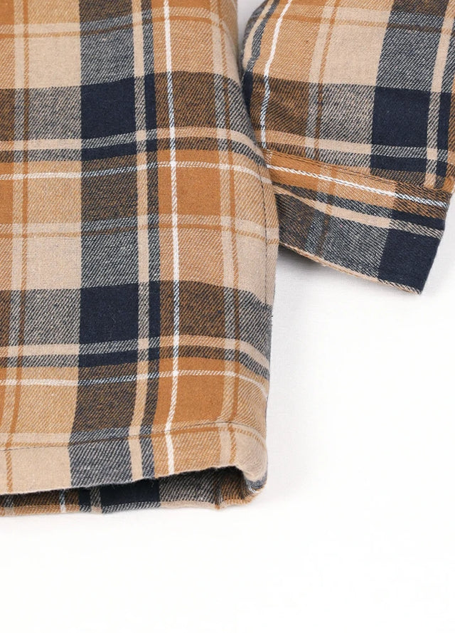 Close-up of the hand pocket of latte navy men's stylish plaid quilted lined hooded jacket