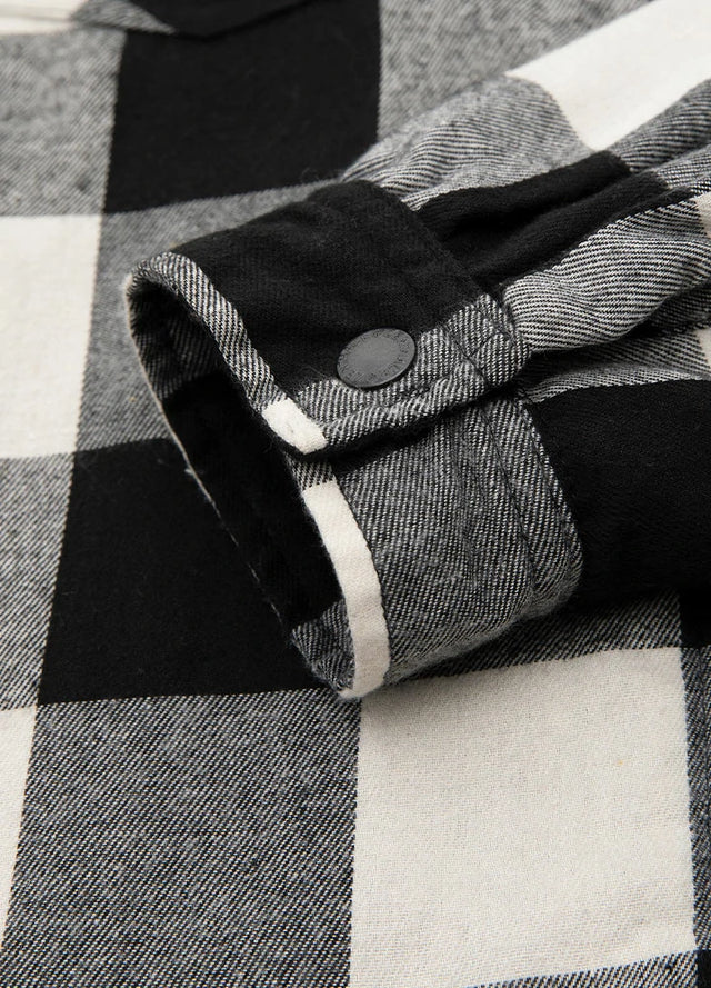 Close-up of the cuff of black beige men's warm zipper flannel hooded jacket