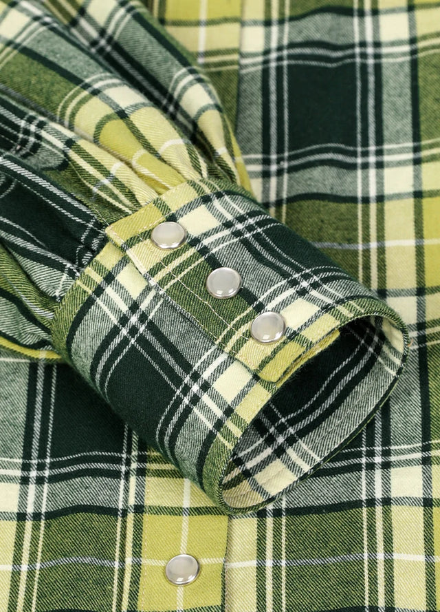 Zoomed-in view of the cuffs on a womens green flannel shirt dress