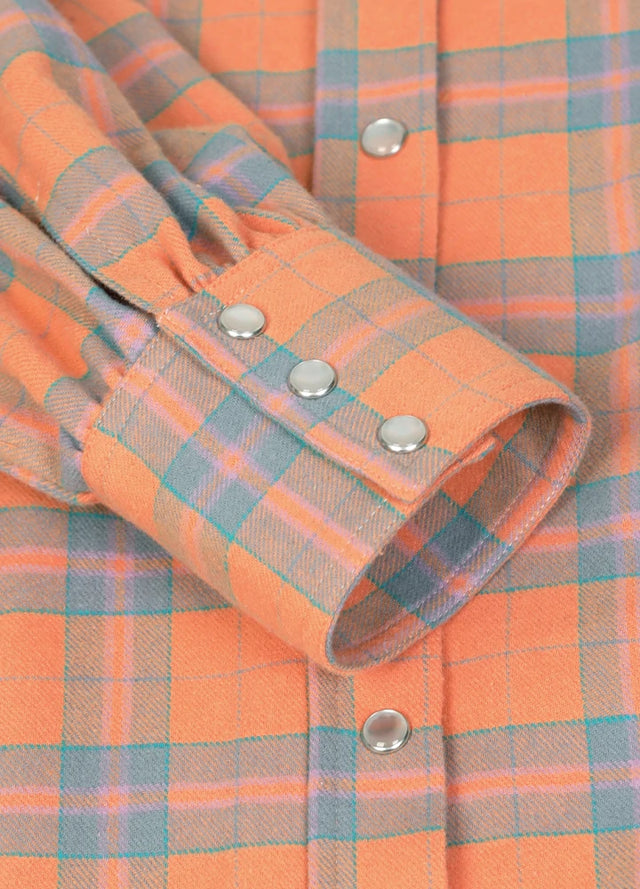 Zoomed-in view of the cuffs on a womens orange flannel shirt dress