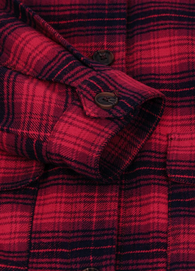 Close-up of women's fall winter red black flannel shacket cuffs