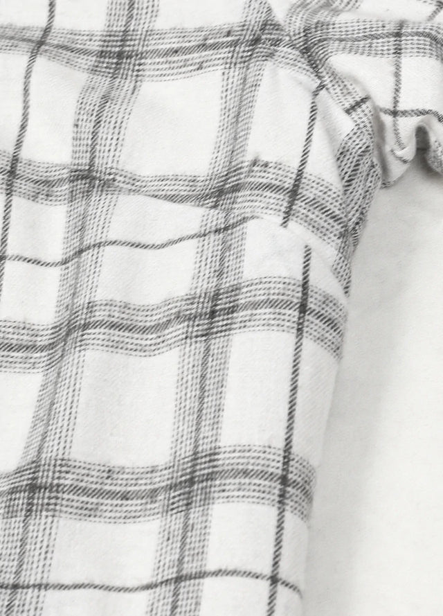 Detailed view of womens white sherpa lined flannel hooded jacket fabric